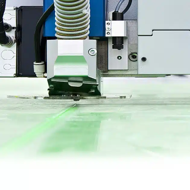 About Us Glass under a CNC machine